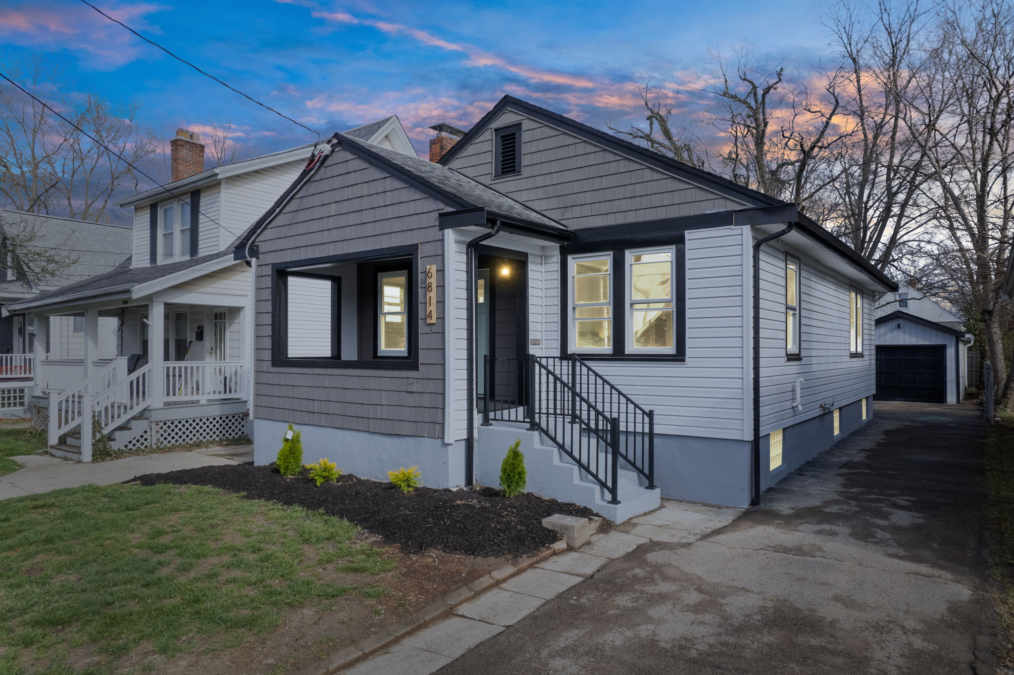 Renovated single-family home exterior at dusk