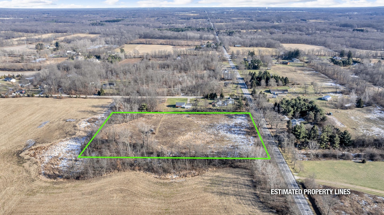 Aerial view of an undeveloped parcel surrounded by rural land